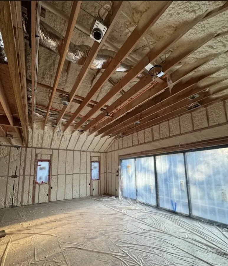 Interior walls and ceiling insulated with spray foam during new construction in North Branford